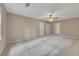 Spacious bedroom features neutral walls, carpet, ceiling fan and large closets for ample storage at 2031 Greyfield Nw Dr, Kennesaw, GA 30152