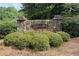 Stone entrance sign for Greyfield North community surrounded by well maintained shrubbery at 2031 Greyfield Nw Dr, Kennesaw, GA 30152