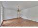 Dining room featuring hardwood floors, crown molding, and a chandelier, providing an elegant space for gatherings at 2031 Greyfield Nw Dr, Kennesaw, GA 30152