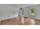 Bright dining room with hardwood floors, crown molding, and large windows, providing an elegant space for gatherings at 2031 Greyfield Nw Dr, Kennesaw, GA 30152