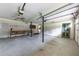 Spacious garage interior features storage space, work area, and convenient access door at 2031 Greyfield Nw Dr, Kennesaw, GA 30152
