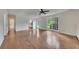 Spacious living room featuring wood floors, natural light and access to kitchen at 2031 Greyfield Nw Dr, Kennesaw, GA 30152