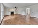Bright living room with fireplace, built-in shelving, and hardwood floors at 2031 Greyfield Nw Dr, Kennesaw, GA 30152