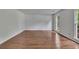 Bright living room with hardwood floors and a large window, offering a spacious and inviting atmosphere at 2031 Greyfield Nw Dr, Kennesaw, GA 30152