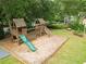 Well-maintained community playground featuring a slide, swings, and climbing structures at 2031 Greyfield Nw Dr, Kennesaw, GA 30152