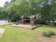 Neighborhood playground with multiple structures, a slide, and swings at 2031 Greyfield Nw Dr, Kennesaw, GA 30152