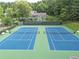 Community tennis courts with benches and lush green surroundings at 2031 Greyfield Nw Dr, Kennesaw, GA 30152