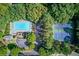 A high angle view of a community swimming pool and tennis courts at 3485 Parkbrooke Ln, Duluth, GA 30096