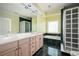 Bright bathroom with double vanity, soaking tub, and glass block shower at 1006 Arbor Ne Trce, Atlanta, GA 30319