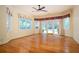Sun-filled bedroom with hardwood floors and a French door leading to a backyard swimming pool at 1006 Arbor Ne Trce, Atlanta, GA 30319