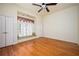 Bedroom with hardwood floors, a window seat, and ceiling fan at 1006 Arbor Ne Trce, Atlanta, GA 30319