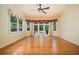 Bright bedroom featuring hardwood floors, large windows, and a glass paneled door to the backyard at 1006 Arbor Ne Trce, Atlanta, GA 30319