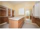 Custom closet design with shelves, drawers, and a central island for storage and organization at 1006 Arbor Ne Trce, Atlanta, GA 30319