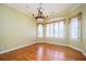 Light-filled dining room with hardwood floors and large windows providing ample natural light at 1006 Arbor Ne Trce, Atlanta, GA 30319