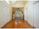 Hallway featuring a bench with curtained wall niches and hardwood floors at 1006 Arbor Ne Trce, Atlanta, GA 30319