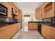 Traditional kitchen featuring granite counters, stainless steel appliances, and tile floors with decorative trim at 1006 Arbor Ne Trce, Atlanta, GA 30319