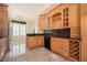 Spacious kitchen with wooden cabinetry, granite countertops, tile floors, and a stainless steel refrigerator at 1006 Arbor Ne Trce, Atlanta, GA 30319