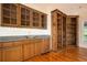 Living room with beautiful hardwood floors, granite countertop, built-in shelving, and cabinets at 1006 Arbor Ne Trce, Atlanta, GA 30319