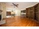 Bright living room with hardwood floors, fireplace, chandelier, and built-in shelving at 1006 Arbor Ne Trce, Atlanta, GA 30319