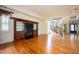 Spacious living room featuring hardwood floors, built-in bar, fireplace, and grand spiral staircase at 1006 Arbor Ne Trce, Atlanta, GA 30319
