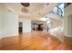 Elegant living room with hardwood floors, a grand spiral staircase, and modern chandelier at 1006 Arbor Ne Trce, Atlanta, GA 30319