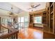 Open loft area with hardwood floors, built-in shelving, and lots of natural light at 1006 Arbor Ne Trce, Atlanta, GA 30319