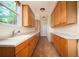 Well-organized pantry with floor-to-ceiling wooden cabinets and bright natural light from window at 1006 Arbor Ne Trce, Atlanta, GA 30319