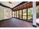 Inviting screened-in porch with wood floors, perfect for enjoying the outdoors at 1006 Arbor Ne Trce, Atlanta, GA 30319