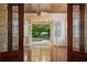 Sun room with hardwood floors and a view of the pool and backyard at 1006 Arbor Ne Trce, Atlanta, GA 30319