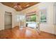 Bright sunroom boasts hardwood floors, wood ceiling, and French doors that open to a swimming pool at 1006 Arbor Ne Trce, Atlanta, GA 30319