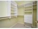 Well-organized walk-in closet with built-in shelving and drawers for ample storage at 1006 Arbor Ne Trce, Atlanta, GA 30319