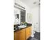 Well-lit bathroom with granite countertop, a vanity, and a modern toilet at 1334 Gates Se Dr, Atlanta, GA 30316