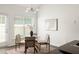 Bright breakfast nook with a round table, four chairs, and natural light from the large window at 1334 Gates Se Dr, Atlanta, GA 30316