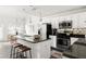 Modern kitchen with granite countertops, stainless steel appliances, and an island with seating at 1334 Gates Se Dr, Atlanta, GA 30316