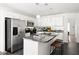 Modern kitchen with granite countertops, stainless steel appliances, and an island with seating at 1334 Gates Se Dr, Atlanta, GA 30316