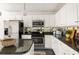 Charming kitchen features granite countertops, stainless steel appliances, and ample cabinet space at 1334 Gates Se Dr, Atlanta, GA 30316