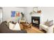 Bright living room featuring a fireplace, modern decor, and hardwood flooring throughout at 1334 Gates Se Dr, Atlanta, GA 30316
