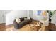 Bright living room featuring a fireplace, modern decor, and hardwood flooring throughout at 1334 Gates Se Dr, Atlanta, GA 30316
