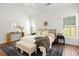 Inviting bedroom features natural light, a ceiling fan, and neutral decor for a tranquil setting at 1334 Gates Se Dr, Atlanta, GA 30316