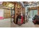 Unfinished basement with exposed ductwork, tool chest, shelving, and a lawn mower at 2713 Misty Rock Cv, Dacula, GA 30019