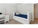This bedroom offers neutral walls, white furniture and light colored carpeting at 2713 Misty Rock Cv, Dacula, GA 30019