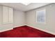 Cozy bedroom featuring a window with blinds, carpeted floor, and a built-in cabinet at 2713 Misty Rock Cv, Dacula, GA 30019