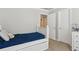 This bedroom features neutral walls, white furniture and a small closet at 2713 Misty Rock Cv, Dacula, GA 30019