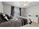 Comfortable bedroom with ceiling fan, closet, and natural light streaming through a bright window at 2713 Misty Rock Cv, Dacula, GA 30019