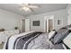 Calm and relaxing bedroom with soft gray walls, ceiling fan, and ensuite bathroom at 2713 Misty Rock Cv, Dacula, GA 30019