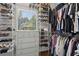 This walk-in closet is fully shelved and racked for ample storage of clothes and accessories at 2713 Misty Rock Cv, Dacula, GA 30019