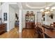 Spacious dining room featuring hardwood floors and access to the kitchen at 2713 Misty Rock Cv, Dacula, GA 30019