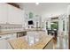 Kitchen showcasing island with granite countertops, stainless appliances and eat-in dining area at 2713 Misty Rock Cv, Dacula, GA 30019