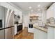 Kitchen showcasing stainless appliances, granite countertops and eat-in breakfast bar at 2713 Misty Rock Cv, Dacula, GA 30019