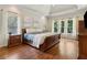 Spacious main bedroom with tray ceiling, hardwood floors and plenty of natural light at 2713 Misty Rock Cv, Dacula, GA 30019